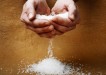 hands pouring salt